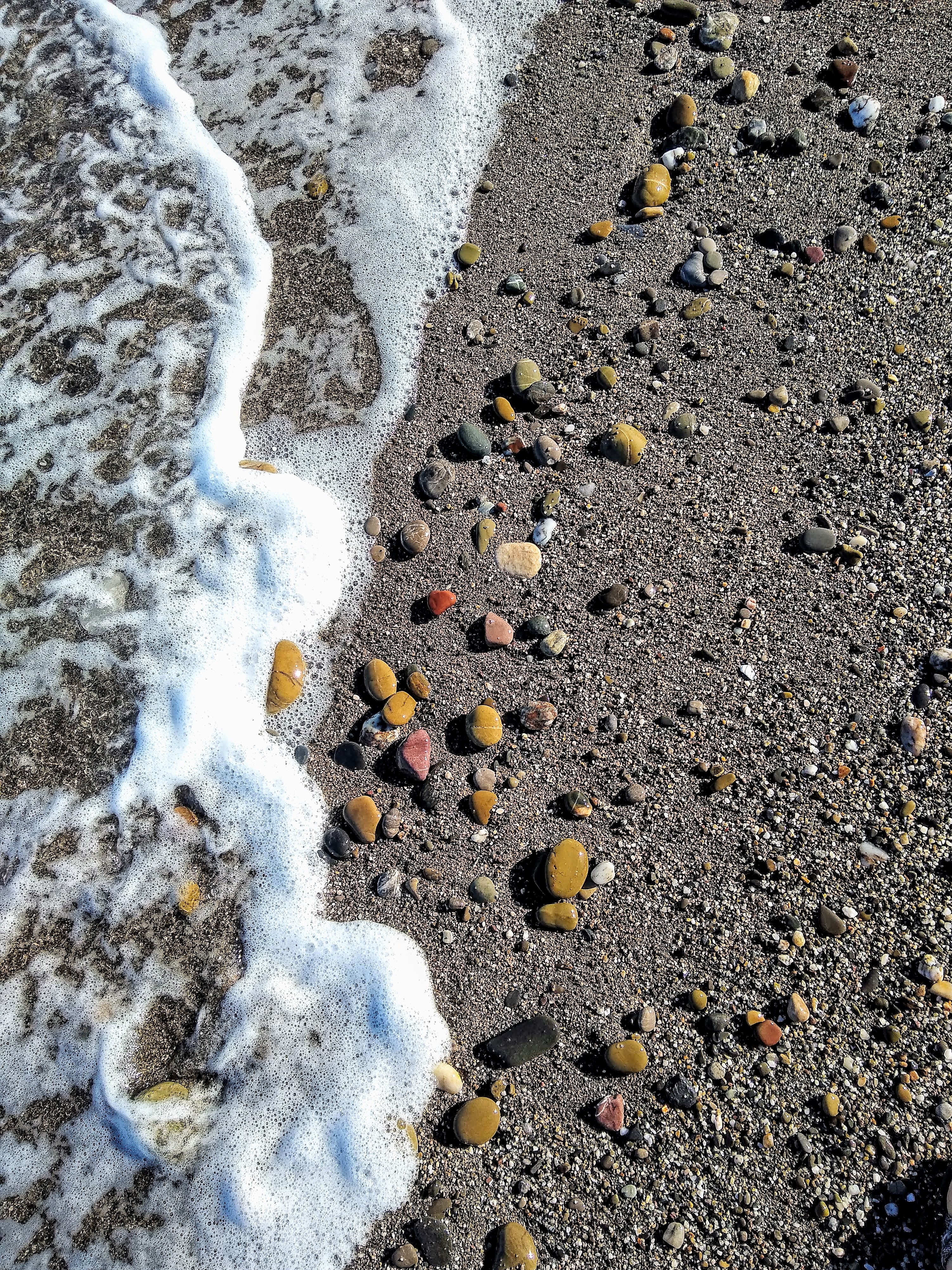 The Mediterranean Sea, near Tetouan, Morocco - close up of sand and pebbles