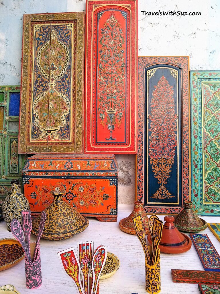 colorful wooden painted doors, chests, and pots