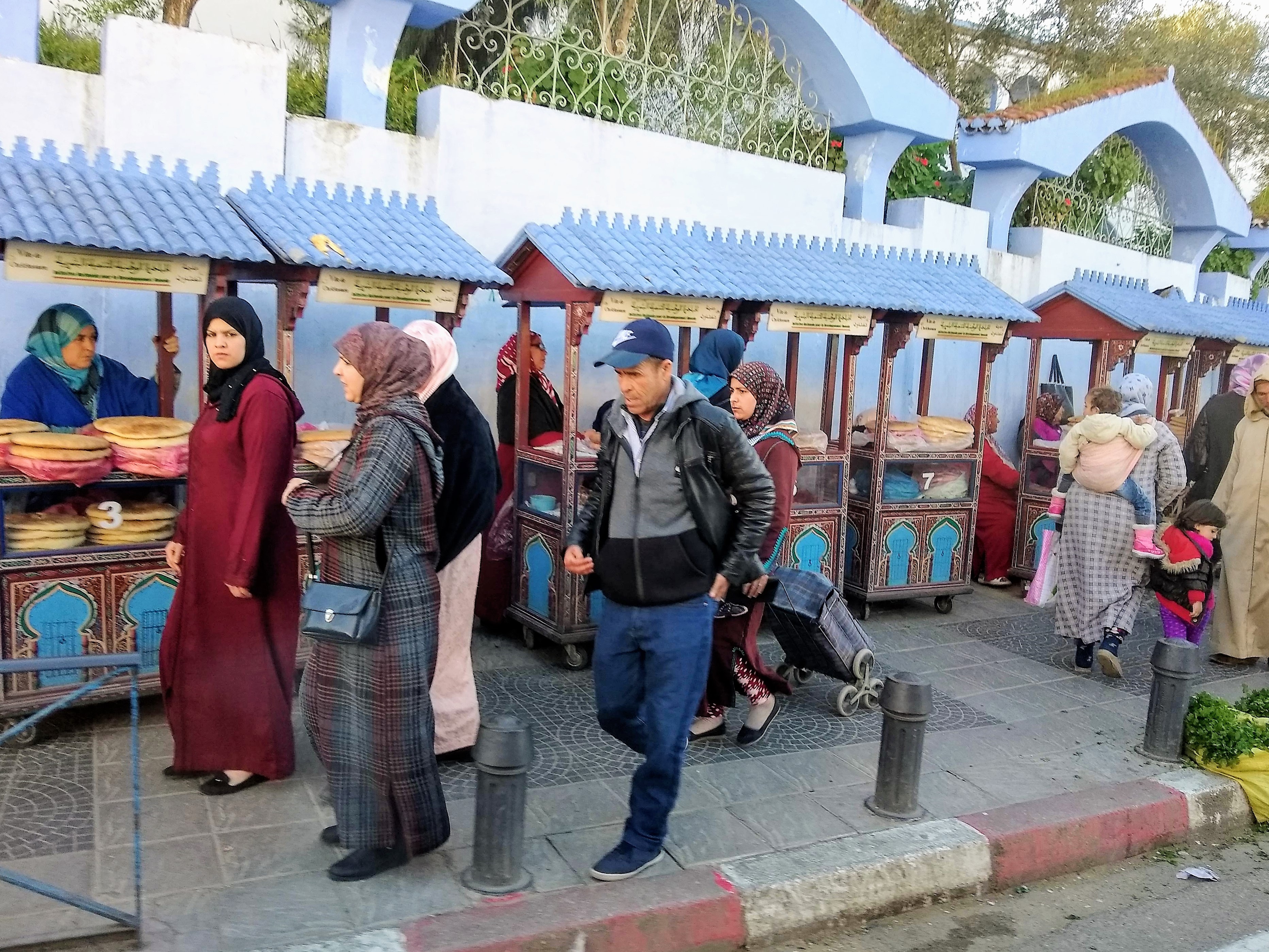 Tetouan, Morocco UNESCO medina scene with vendors and women